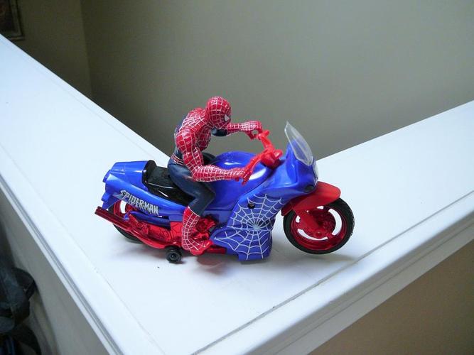 Spiderman on motorcycle moves around