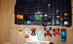 34 mixed toy cars,hotwheels, majorette,cars,etc.comes with hotwheels case that holds up to 100 cars.Also comes with car launcher and 5 pieces of hotwheels track still in package.$20.firm.located in Truro.