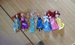 Set of seven Disney barbies. Barely played with. Missing one shoe. Smoke free home.