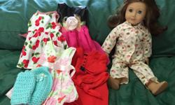 Used Good Condition American Girl Doll includes a few doll clothes.