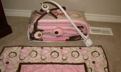 I am selling a baby girl crib bedding set and includes the following items: fitted sheet, bumper pads, comforter, matching mobile, matching lamp, matching blankets, and matching pillow.  Everything is in very good condition.  I am located in Woodstock.