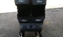 Double jogging stroller can be used in swivel or straight mode. Large wheels are great especially in the snow. This stroller is in excellent condition and used only for a short while. Colour is Black. There are lots of compartments for keys, water