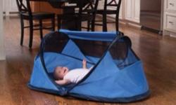 Barely used, in like new condition. KidCo's PeaPod? Lite; model P001 in Periwinkle blue, is the travel bed that does it all for the on-the-go parent! This smaller, 2-hoop design is great for outdoors because of its UV protection and wind screens. Zippered