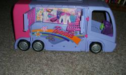 This Barbie disco camper is in excellent condition, It opens to reveal a disco, complete with mirrored balls.