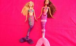 Selling our Barbie collection - these are not beaten up Barbies that have been well played with - these are in fantastic condition and come from a smoke free home.
These are two Fairy Tale Magic Mermaid Barbie's.
See our other Barbie adds here: (I'll