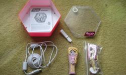 Barbie Girl MP3 Player comes with USB docking station, registration CD, and reusable storage case. 512 MB memory for MP3 songs. Additional fashion accessories, cover plates, etc.