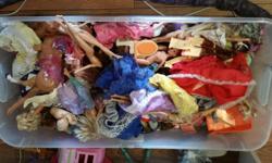 Approximately 18 Barbies and 2 Ken dolls.
2 Barbie cars
Tons of Barbie clothes and accessories
House comes with furniture