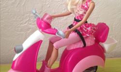 Rarely used Barbie doll with scooter. Helmet included.