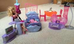 Barbie comes with bed, table and chairs, mini tv, and several other accessories as seen in the pictures. Comes from a pet and smoke free home.
