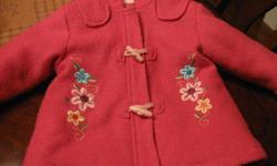 This is a sweet toddler winter coat that has embroidered flowers and toggles. Great condition!