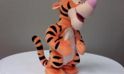 Bounces with a "boing", and says "Hoo, hoo, hoo, hoo - bouncing is what Tiggers do best".
Excellent condition.