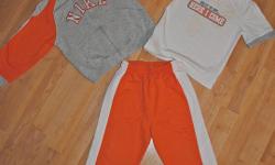 Orange/gray/white Nike track suit with shirt size 24 month
(what looks to be staining on the shirt is not. They are "footprints" and part of the shirt) - Paid over $30 for this new.
 
Red with blue lined track suit size 2T
 
Green/white/black track suit