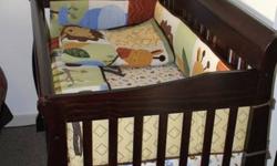 This crib turns into a double bed. It has been slept in only a handful of times. Comes with mattress, jungle Baby R Us bed set, and mobile. Brand new with no markings.