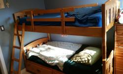 Twin-sized captain's bunk bed for sale. Bunkbed can come apart into two separate beds. Mattresses not included.