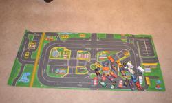 Car mat measuring 24 by 56" with 25 used cars.
