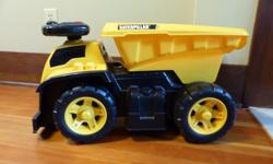 Great ride-on dump truck with horn and other noise-buttons (as well as an on/off switch, you'll be happy to know!) In really good shape - this was only used indoors though it could be indoors/outdoors. Very tough! Also has places to fit megablocks, so