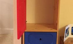 Sturdy pine and heavy plastic wardrobe from IKEA - rod can be placed in top section to hang clothes.
69"H x 19" W x 17" deep - like new condition.
