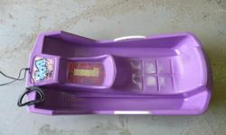 It is a Play Bob Toboggan. Purple in color. Dimensions are 32" long by 15" wide.