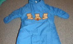 Very cute snow suit with teddy bears.  Very easy to get baby in and out, the bottom just folds down and back up and the rest is velcro.  Includes a slot for the car seat strap to fit through.  Nice and warm for winter.  Excellent used condition.