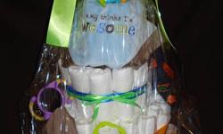 Looking for memorable baby gift?
Diaper cakes are always a hit at any baby shower...but can be time consuming and tedious.
Allow me to create a one of a kind gift for Mom-to-be that includes an assortment of special items.  Basics include: brand-name