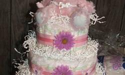 If you are looking for a unique gift for a baby shower or to welcome a new baby, look no further! I can make diaper cakes or gift baskets for you to present to the proud new parents! I do different themes and colors. 2 tier or 3 tier available! KEEP IN