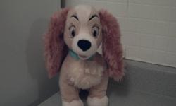 The adorable Lady loves Tramp, romantic spaghetti dinners at Italian restaurants and lots and lots of hugs. The star of Disney's 1955 classic Lady and the Tramp shows her soft side with this Lady Plush Toy.
She also bears an official Disney Store patch on