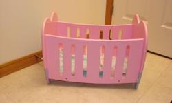 Large  pink (wood) doll bed