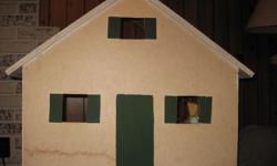 Wooden doll house which includes some furnishings - 29" wide, 24" high.