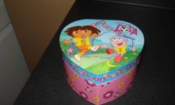 I am selling this Dora Music Box. It has Dora and Boots pictured on the top. Dora spins to the music and it also has a mirror inside. It is in good condition and I am selling it for best offer.
 
Can deliver for a small fee depending on location.
 
Check
