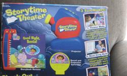Storytime theatre with projector and one read along storybook and projection and sound cartridge Tells the story and displays the pictures and text on a nearby wall. You control the story by turning the pages at your own pace. Turns off when finished the