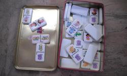 Beautiful full set of Dora Dominoes, white background with full colour images of Dora characters, in tin. See my seller's list for other Dora the Explorer merchandise.
