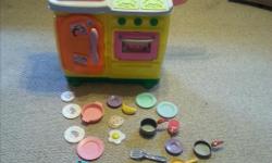 Dora kitchen set. Very good shape. Includes some kitchen dishes to play with.