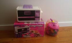 An older style easy bake oven but fun nonetheless!!!
This is package has the oven as well as a bonus pack of utensils and cookie cutters.
ohhhhh, the fun and delicious snacks we have had...and easy-bake is just that much easier now that you can get