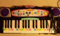 FREE electric piano - By Fisher Price - comes with caritage and plugs into TV - but the electric cord is damaged - can use batteries then it works great