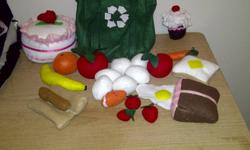 Assortment of felt food incl. eggs, tomato, carrot, strawberries, cake, hot dog etc. Lots of pieces and a great little bag to put them in. Excellent condition
