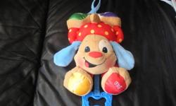 This is a Fisher-Price Sing & Play Puppy. It was hanging in the crib for a little while, but the blue "cord" was maybe pulled down twice. Comes with the box and would make an excellent Gift! Asking $20.
*Musical Puppy is a soft fluffy toy that will