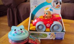 the small toy for ages 3 months and up...the race car for ages 6 months to 36 months..car has a light up windshield..plays music,sounds and songs..switch to motorized mode to race,crawl and chase....both brand new