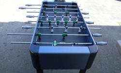 Foosball table in excellent condition with extra balls.Electronic score board.