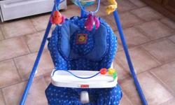 FisherPrice Aquarium Cradle Swing.
 
2 ways to swing.
 
Blue seat cushion with removable tray.