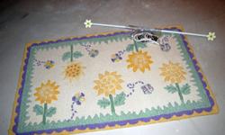 Pottery Barn Kids - 3'x5' sunflower wool rug and matching sunflower curtain rod, with jeweled butterfly tie backs. All pieces like new. No damage or stains. All hardware included.