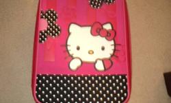 I have a small hello kitty suitcase in good shape for a child dont use it any more it has a pull out handle and two wheels it is a bit bigger than a foot by a foot and a half please email me