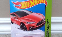 Still in the box, red Tesla Model S. Feel free to email or text @ 250-217-2815.
