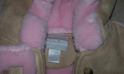Gorgeous and super soft! This snowsuit will keep your baby warm this winter with its soft inner lining.  Size 6-9 months. $20.00