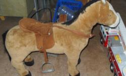 large, sturdy and solid
made to ride on horse.
has saddle with metal stirrups and bridle.
has soft push body with padding over a solid wooden framing.
brushable body, mane and tail
not a rocking horse
also have a tiger with open mouth and teeth barred.-