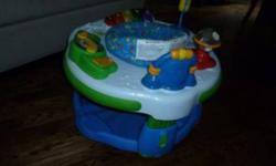 In new condition. Lots of fun, with 5 stations, lights, music, sounds, alphabet and numerals for baby to learn.