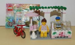 LEGO Town 6402 Sidewalk Cafe from 1994. Includes both mini-figures, bicycle and instructions.