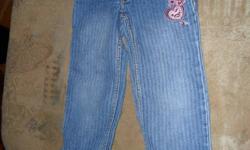 A great pair of Levis jeans with a pink leopard skin cuff and pink trim on the pockets. Size 4