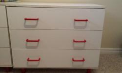 Excellent condition white and with red handles. 3 large drawers great for toys, clothes or any storage. Nice, solid and bright for any room. 33 inch wide X 18 inch deep X 27.5 inch high. Asking $10