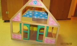 Little wooden doll house.  Great for Barbies and such.