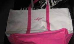 MUST SELL DUE TO MOVING TOTE BAG THAT HAS MEGAN ON IT. HAD IT CUSTOM MADE. ITS PINK GREAT FOR A DIAPER BAG OR FOR THE BOAT.
